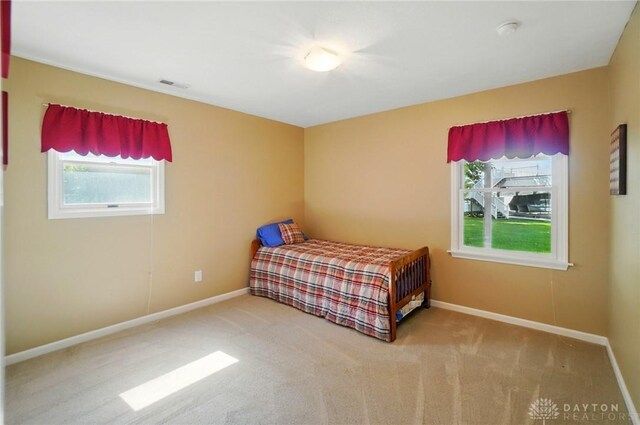9113 Maple St, Huntsville, OH 43324 - carpeted bedroom with baseboards