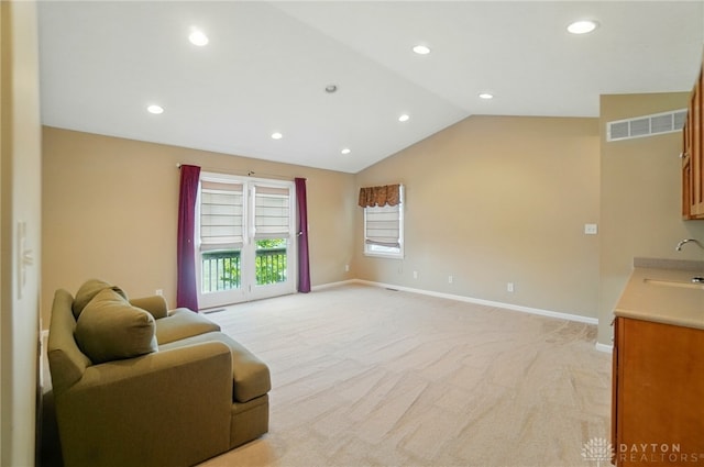9113 Maple St, Huntsville, OH 43324 - living room with recessed lighting, light colored carpet, and lofted ceiling