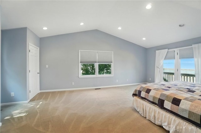 9113 Maple St, Huntsville, OH 43324 - bedroom featuring access to exterior, light colored carpet, multiple windows, vaulted ceiling, and recessed lighting