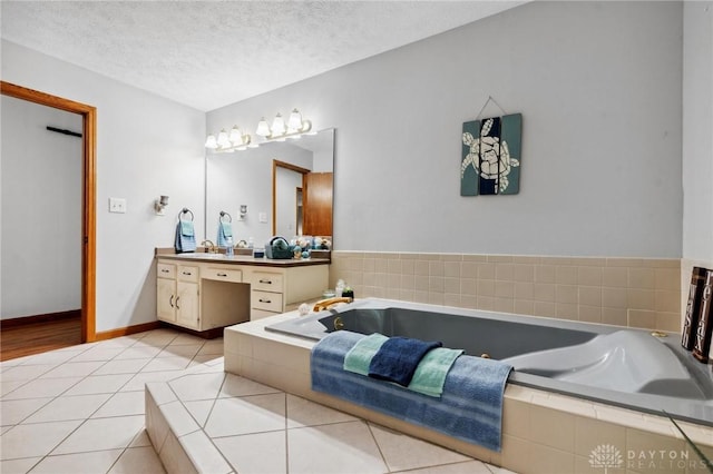 923 Lewis Creek Ct, Xenia, OH 45385 - full bathroom with vanity, a bath, a textured ceiling, and tile patterned flooring