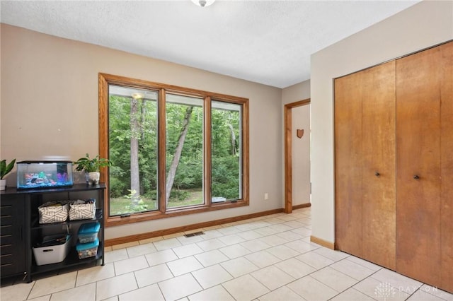 923 Lewis Creek Ct, Xenia, OH 45385 - doorway to outside with baseboards and a textured ceiling