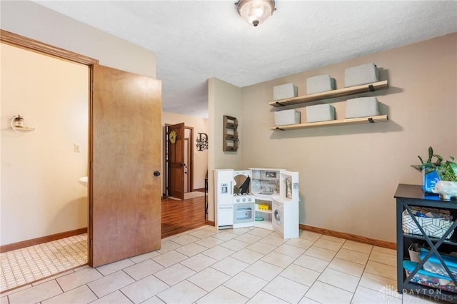 923 Lewis Creek Ct, Xenia, OH 45385 - interior space featuring a textured ceiling and light tile patterned floors