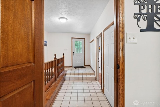 923 Lewis Creek Ct, Xenia, OH 45385 - corridor featuring light tile patterned floors and a textured ceiling