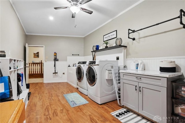 923 Lewis Creek Ct, Xenia, OH 45385 - laundry room featuring cabinet space, independent washer and dryer, crown molding, light wood-style flooring, and ceiling fan