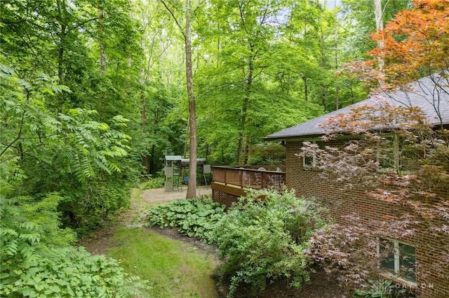923 Lewis Creek Ct, Xenia, OH 45385 - view of yard with a deck and a wooded view