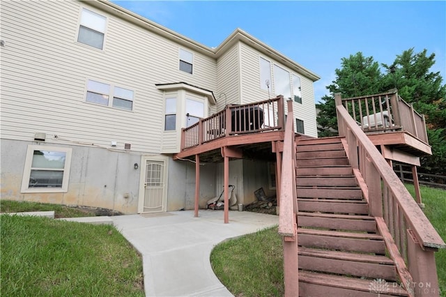 12052 Doe Run Ct, Springfield Twp, OH 45240 - back of property featuring a patio area, stairway, and a wooden deck