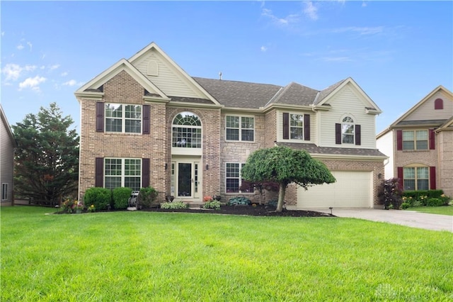 12052 Doe Run Ct, Springfield Twp, OH 45240 - view of front of house with driveway, a garage, a front yard, brick siding, and roof with shingles