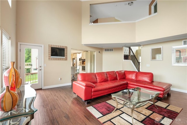 12052 Doe Run Ct, Springfield Twp, OH 45240 - living room with a high ceiling, wood finished floors, and stairway