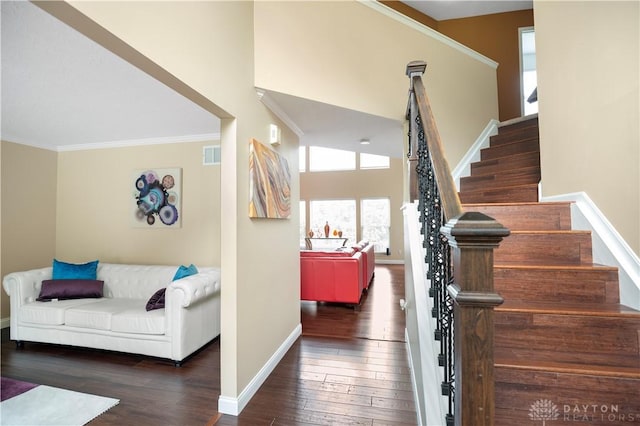 12052 Doe Run Ct, Springfield Twp, OH 45240 - stairway featuring crown molding and wood-type flooring
