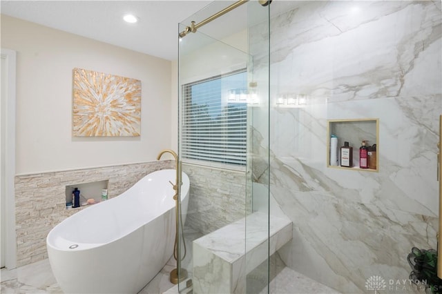 12052 Doe Run Ct, Springfield Twp, OH 45240 - bathroom with a soaking tub, a marble finish shower, tile walls, and marble finish flooring