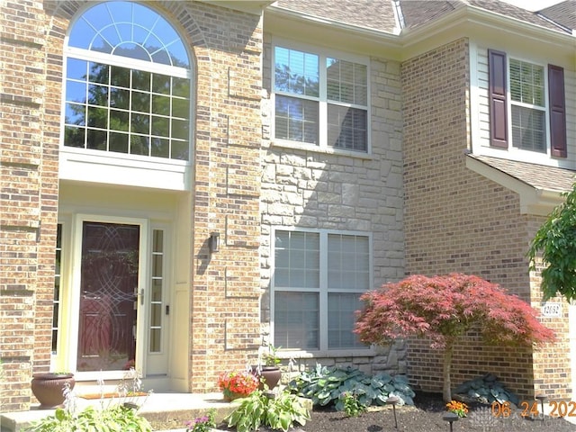 12052 Doe Run Ct, Springfield Twp, OH 45240 - property entrance featuring brick siding and a shingled roof