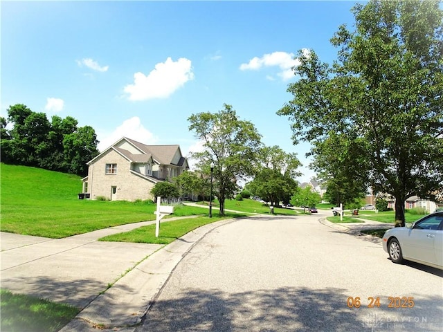 12052 Doe Run Ct, Springfield Twp, OH 45240 - view of asphalt street with street lighting, sidewalks, and curbs