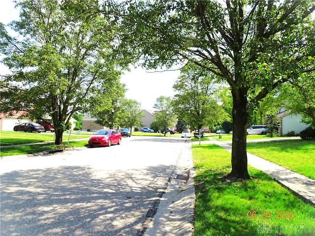 12052 Doe Run Ct, Springfield Twp, OH 45240 - view of asphalt road with curbs, sidewalks, and a residential view