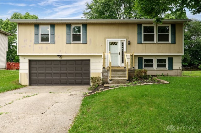 113 Marrett Farm Rd, Englewood, OH 45322 - raised ranch featuring a garage, a front lawn, and concrete driveway