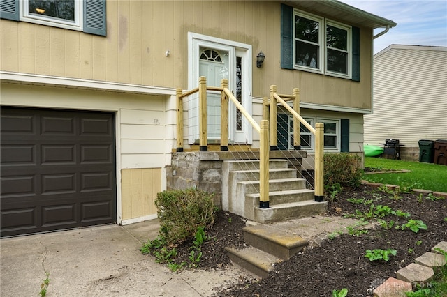 113 Marrett Farm Rd, Englewood, OH 45322 - view of exterior entry featuring an attached garage and concrete driveway