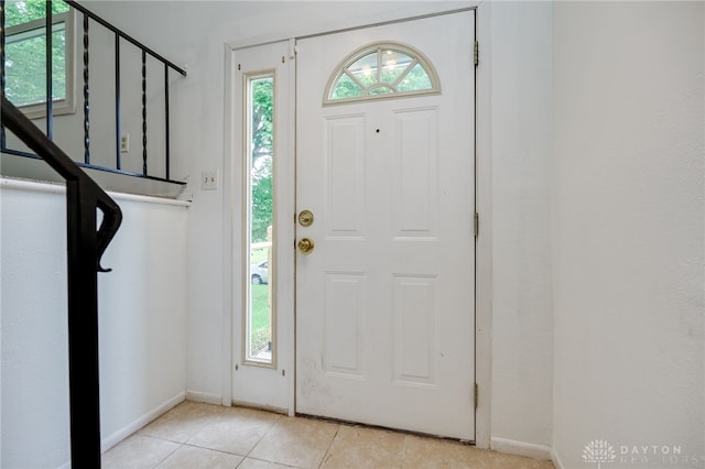 113 Marrett Farm Rd, Englewood, OH 45322 - entrance foyer with light tile patterned floors and stairs