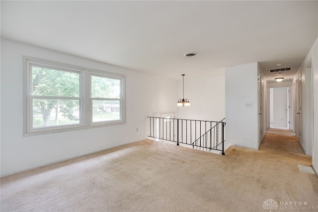 113 Marrett Farm Rd, Englewood, OH 45322 - carpeted empty room with a chandelier