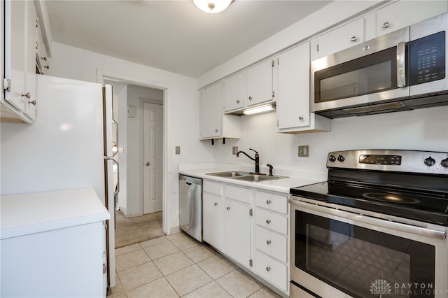 113 Marrett Farm Rd, Englewood, OH 45322 - kitchen featuring appliances with stainless steel finishes, light countertops, white cabinets, and light tile patterned floors