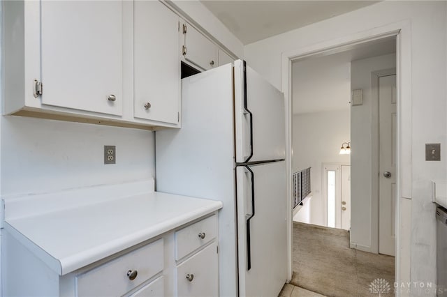 113 Marrett Farm Rd, Englewood, OH 45322 - kitchen featuring freestanding refrigerator, white cabinets, light countertops, light carpet, and dishwasher