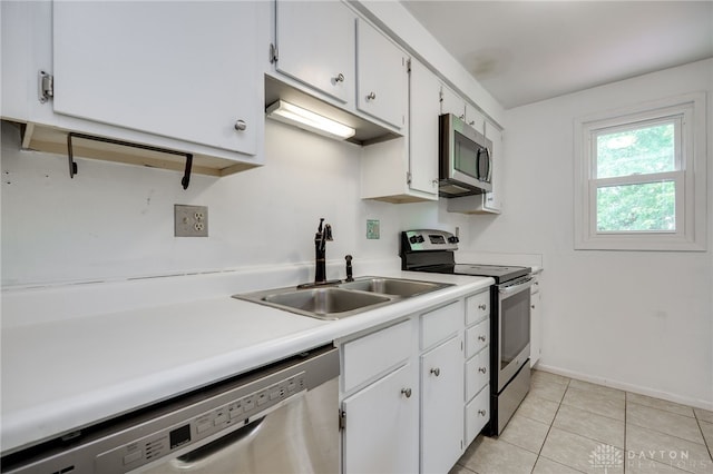 113 Marrett Farm Rd, Englewood, OH 45322 - kitchen featuring stainless steel appliances, light countertops, white cabinets, and light tile patterned floors
