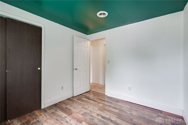 113 Marrett Farm Rd, Englewood, OH 45322 - unfurnished bedroom with wood finished floors and a closet