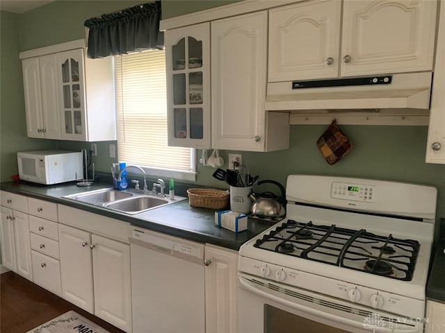 2222 Koebel Rd, Columbus, OH 43207 - kitchen with white appliances, under cabinet range hood, white cabinets, and glass insert cabinets