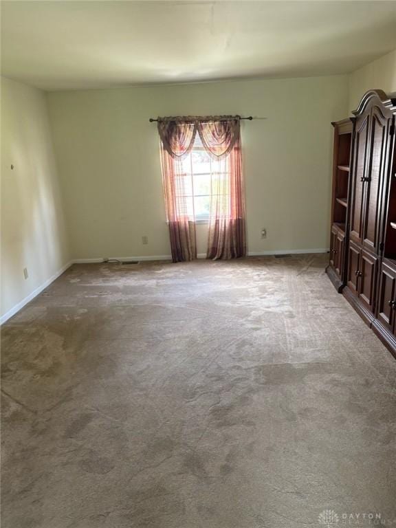 2222 Koebel Rd, Columbus, OH 43207 - spare room with carpet and baseboards