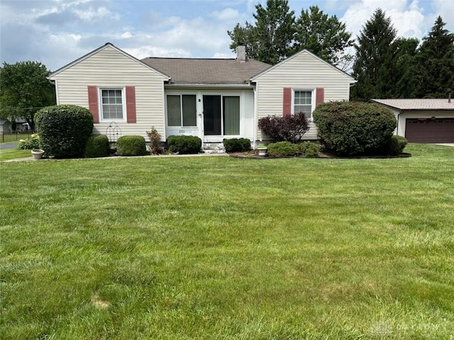 2222 Koebel Rd, Columbus, OH 43207 - view of front facade featuring a front yard and roof with shingles