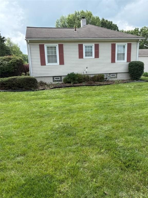 2222 Koebel Rd, Columbus, OH 43207 - view of front of property featuring a front yard and a chimney