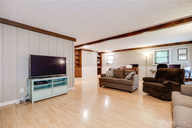 4675 Dearth Rd, Franklin Twp, OH 45005 - living area featuring a decorative wall, beam ceiling, light wood-style floors, crown molding, and wainscoting