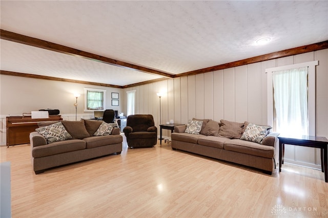 4675 Dearth Rd, Franklin Twp, OH 45005 - living room featuring wood finished floors, a decorative wall, beam ceiling, and crown molding