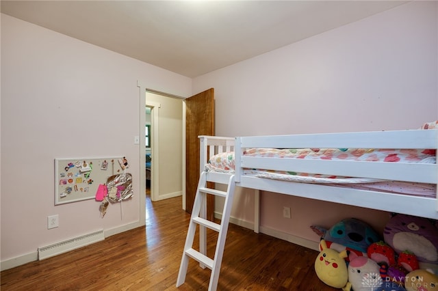 4675 Dearth Rd, Franklin Twp, OH 45005 - bedroom featuring baseboard heating and wood finished floors