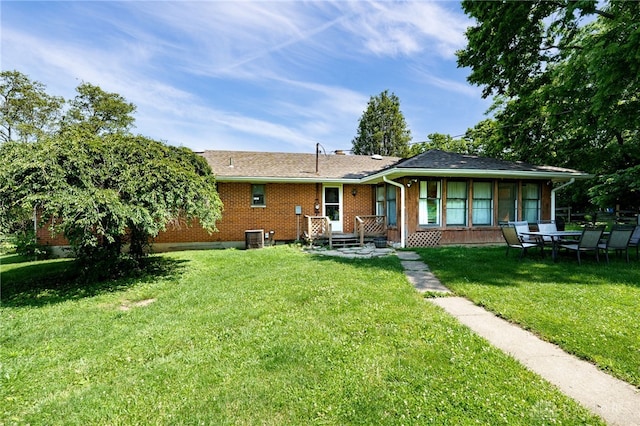 4675 Dearth Rd, Franklin Twp, OH 45005 - rear view of house featuring a yard and brick siding