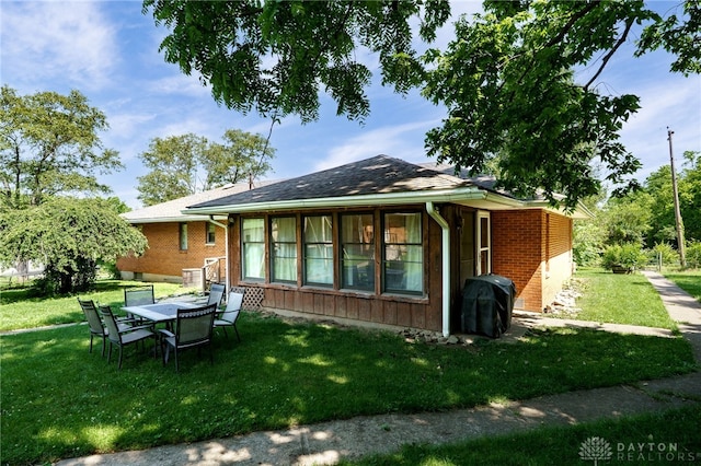 4675 Dearth Rd, Franklin Twp, OH 45005 - back of house featuring a yard and brick siding