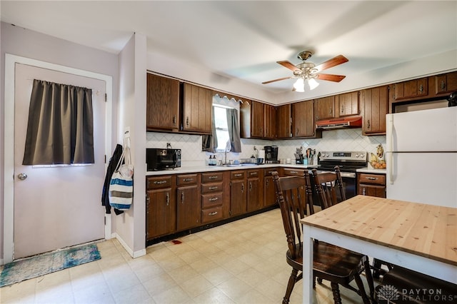 4675 Dearth Rd, Franklin Twp, OH 45005 - kitchen featuring freestanding refrigerator, under cabinet range hood, stainless steel electric range oven, light countertops, and black microwave