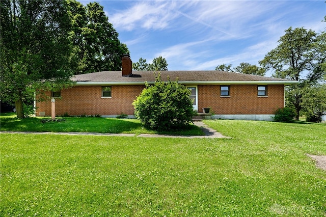 4675 Dearth Rd, Franklin Twp, OH 45005 - rear view of property with a chimney, a yard, and brick siding