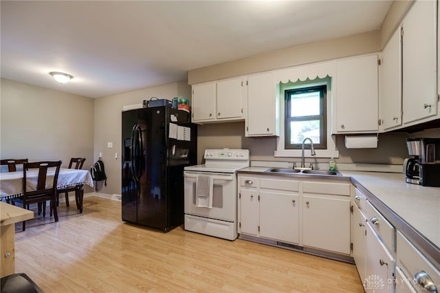 4675 Dearth Rd, Franklin Twp, OH 45005 - kitchen featuring white electric stove, black refrigerator with ice dispenser, white cabinetry, light wood-style floors, and light countertops