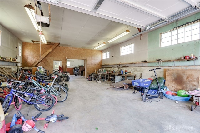 4675 Dearth Rd, Franklin Twp, OH 45005 - garage with a garage door opener and a workshop area