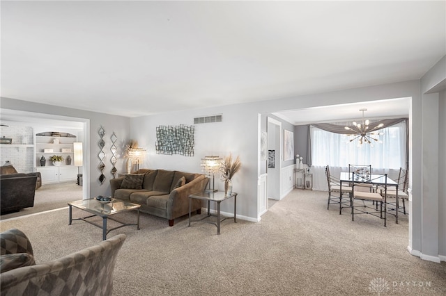 440 David Ln, Mason, OH 45040 - carpeted living room with a chandelier and baseboards