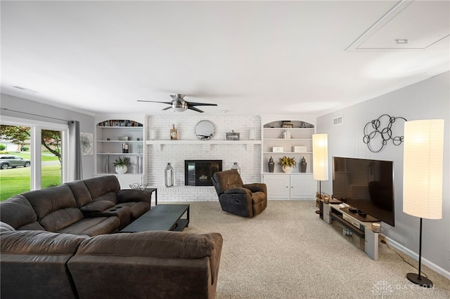 440 David Ln, Mason, OH 45040 - living room with a ceiling fan, carpet, attic access, a fireplace, and built in features
