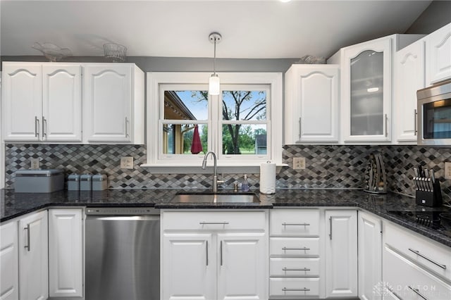 440 David Ln, Mason, OH 45040 - kitchen featuring appliances with stainless steel finishes, white cabinets, decorative backsplash, and glass insert cabinets