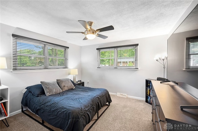 440 David Ln, Mason, OH 45040 - bedroom with carpet flooring, ceiling fan, and a textured ceiling