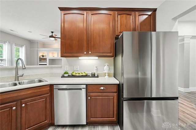 10101 Sawtry Ln, Washington Twp, OH 45458 - kitchen featuring appliances with stainless steel finishes, ceiling fan, light countertops, and light wood-style floors