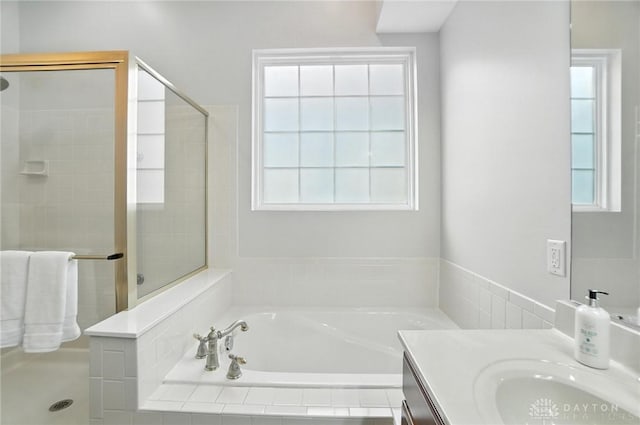10101 Sawtry Ln, Washington Twp, OH 45458 - bathroom with vanity, a garden tub, a stall shower, and plenty of natural light