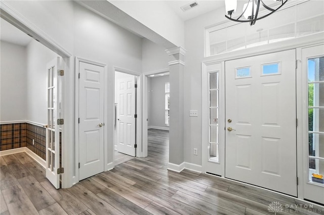 10101 Sawtry Ln, Washington Twp, OH 45458 - entryway with wood finished floors, healthy amount of natural light, and a chandelier