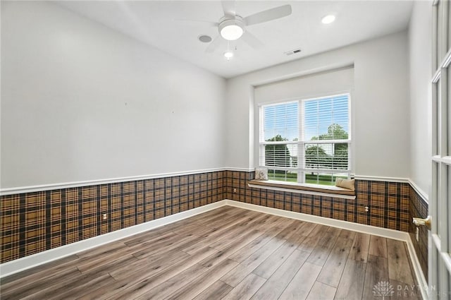 10101 Sawtry Ln, Washington Twp, OH 45458 - spare room featuring wood finished floors, ceiling fan, a wainscoted wall, and recessed lighting