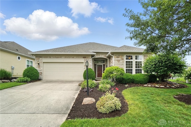 10101 Sawtry Ln, Washington Twp, OH 45458 - view of front of property featuring stone siding, an attached garage, driveway, a front lawn, and a shingled roof