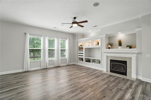 10101 Sawtry Ln, Washington Twp, OH 45458 - unfurnished living room with ceiling fan, wood finished floors, a tiled fireplace, ornamental molding, and recessed lighting