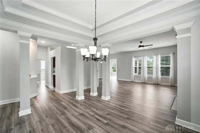 10101 Sawtry Ln, Washington Twp, OH 45458 - unfurnished dining area with dark wood-style floors, a chandelier, a tray ceiling, a ceiling fan, and crown molding