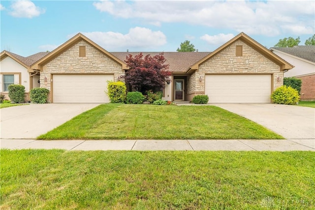 797 Waldsmith Way, Vandalia, OH 45377 - view of front facade with concrete driveway, stone siding, an attached garage, and a front yard